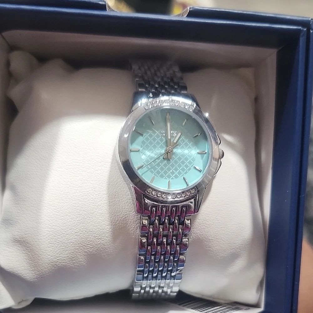 Montres Prestige by Invicta women's 27mm steel watch with a blue/teal dial
